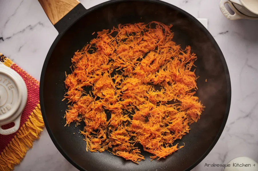 In a non-stick skillet, add the olive oil and carrot. Let it cook for a couple of minutes, or until it softens.

