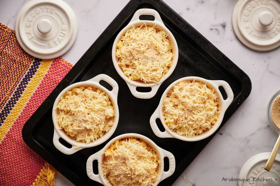 Transfer to 4 ramekins or individual baking dishes (you can also transfer to a big baking tray). Top with the rest of the cheddar cheese and breadcrumbs.
