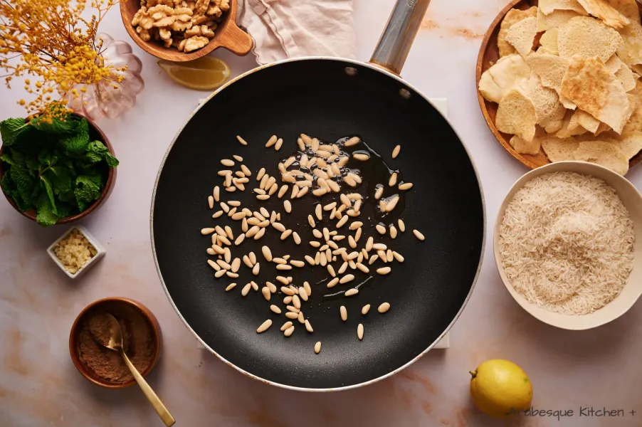 In the same skillet, add a bit more oil (about 1 tsp.) and add the pine nuts, cook until toasted, about 5 minutes. Repeat the process with the almonds and nuts. Reserve.

