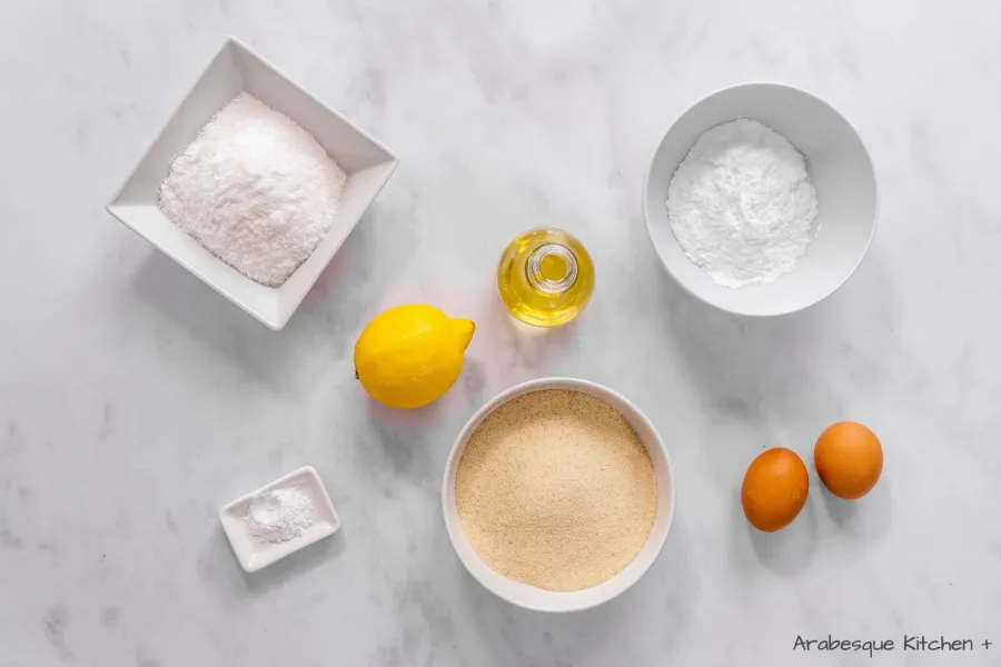 In a medium bowl, whisk the eggs with the icing sugar, lemon zest and oil.
Add in the grated coconut, semolina flour and baking powder. Mix well to combine, then as the dough comes together, start kneading until smooth.
