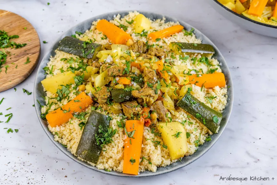 Drizzle with the sauce and sprinkle with chopped herbs. Put the rest of the sauce in a bowl to serve with the couscous.