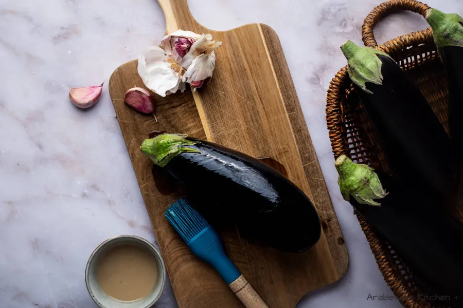 Brush the eggplants with olive oil and grill them for 30-40 minutes, flipping them so they get charred on every side. Once they are charred, let them cool.
