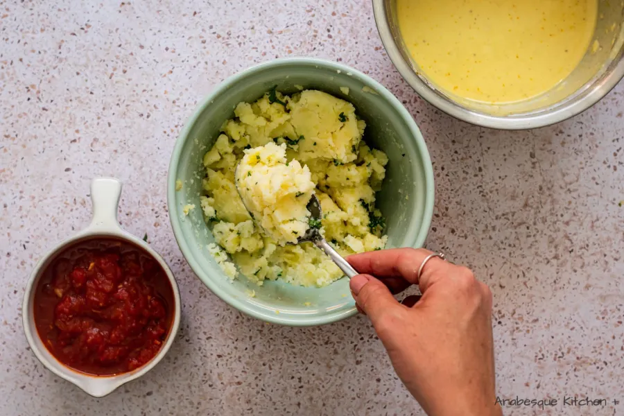 Grab a chunk with a big spoon and form a ball. Repeat with the rest of the potatoes.