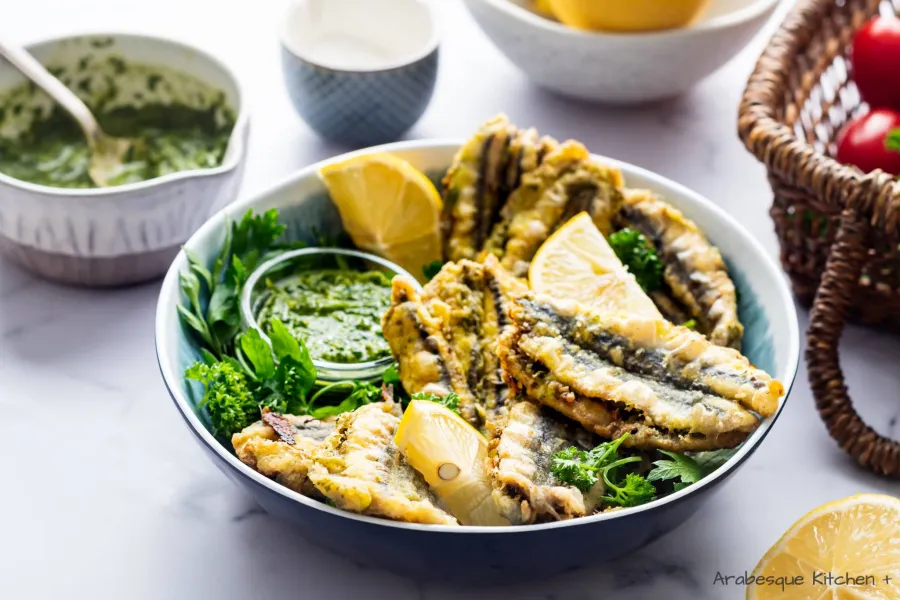 Serve warm with fresh parsley, lemon wedges and more chermoula.
